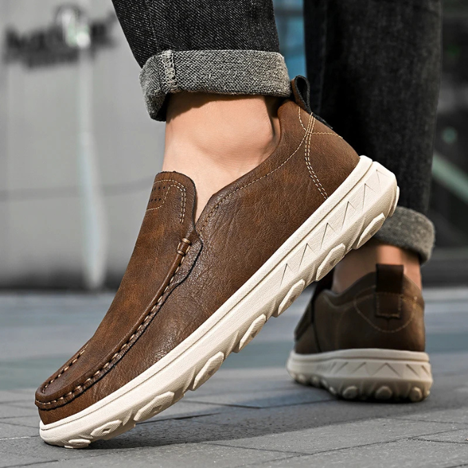 Pair of men's versatile slip-on loafers in a light tan color, perfect for dress casual.