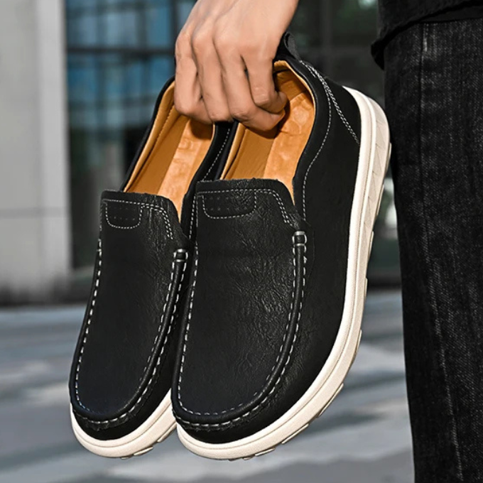 Casual men's maroon leather slip-on loafers, unique color, comfortable everyday footwear.