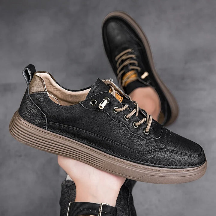 Lifestyle shot of men's brown leather sneakers worn, comfortable for walking