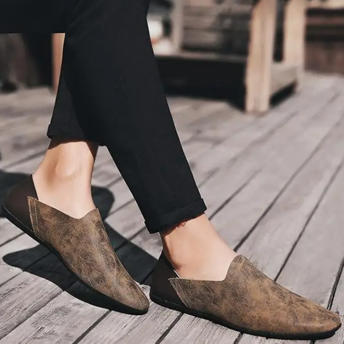 Brown men's slip-on loafers, showcasing microfiber texture for casual style