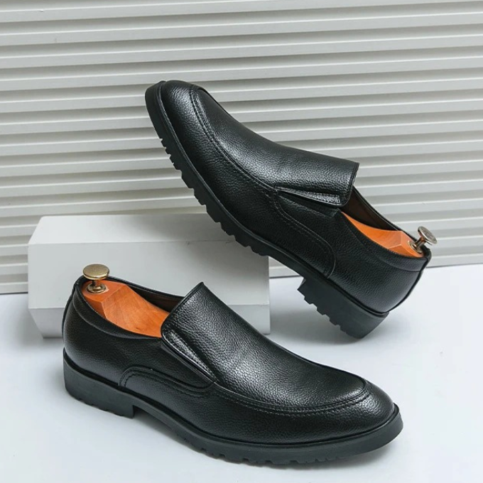 Light brown suede men's slip-on loafers, providing a soft, comfortable feel for casual fashion.