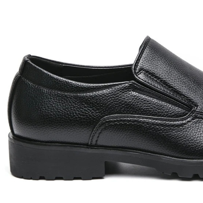 Close-up of the textured upper of a men's casual slip-on loafer, emphasizing quality and comfort.