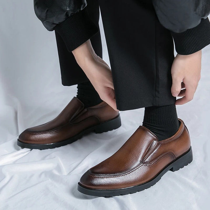 Stylish black slip-on loafers for men, offering comfort and versatility for casual and dress occasions.