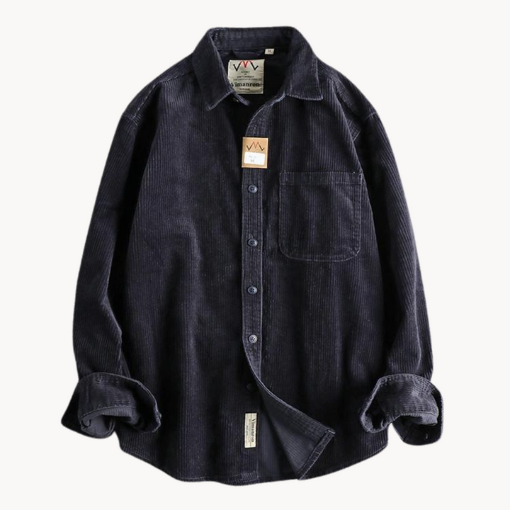 Detailed shot of the buttons and collar on a men's corduroy long sleeve shirt, suitable for casual outings.