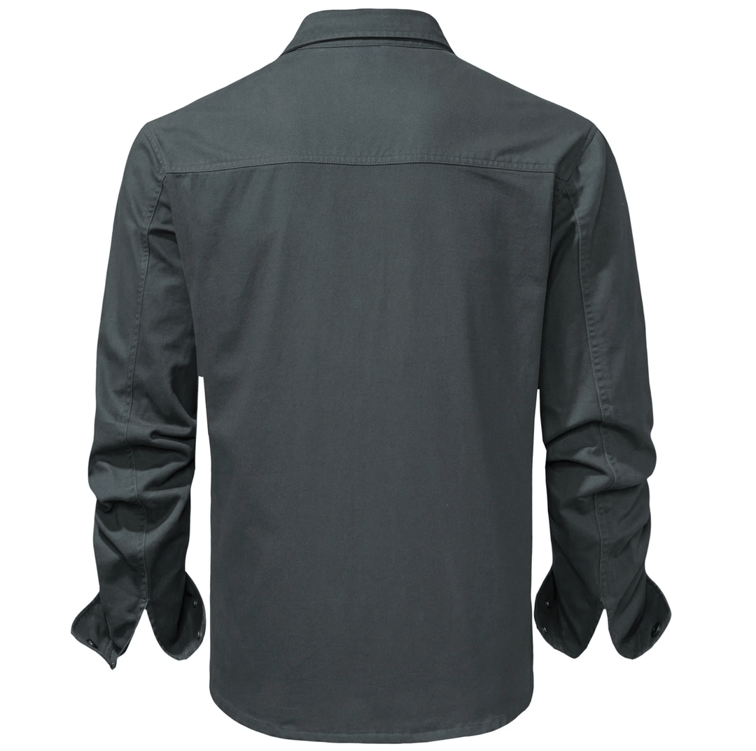 Detail of pocket flap on a men's practical cotton button-up utility shirt jacket.