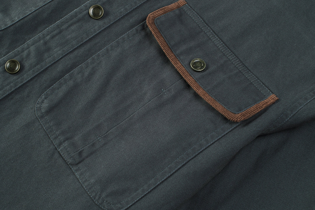 Model from behind, showing the fit of a men's cotton button-up shirt jacket.