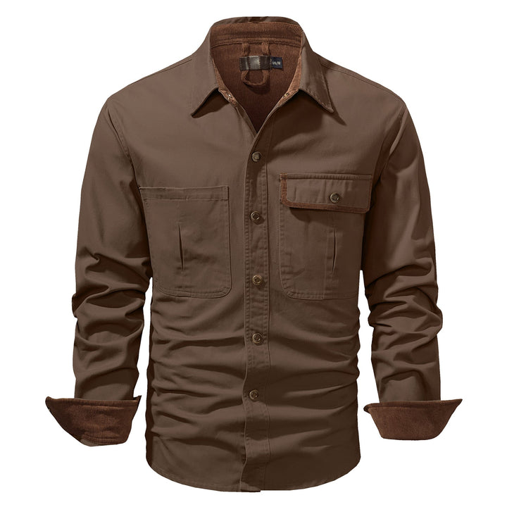 Close-up of the durable fabric on a men's cotton button-up shirt jacket, texture visible.