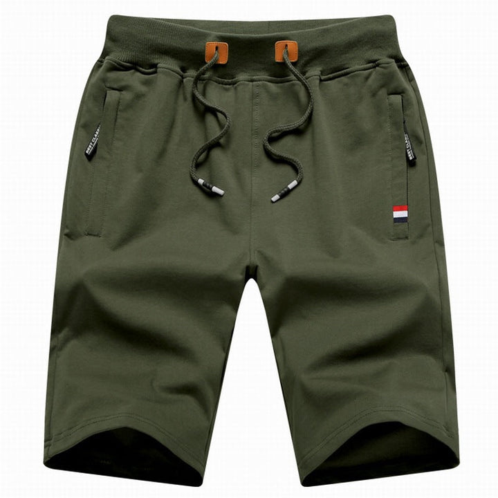 Comfortable men's drawstring shorts with a relaxed fit & handy zipper pockets, ideal for summer & everyday wear.