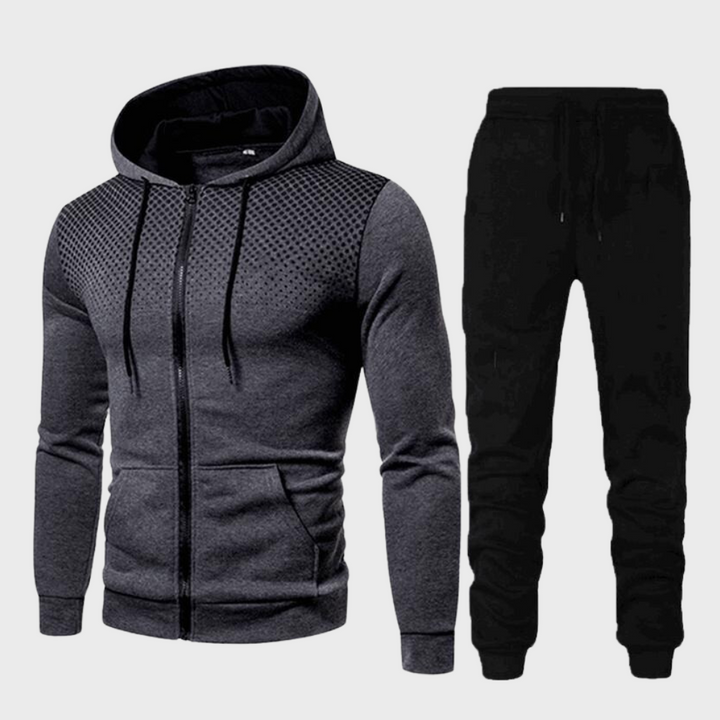 Close-up of a men's navy blue tracksuit hoodie, showcasing soft fabric and a practical front pocket.