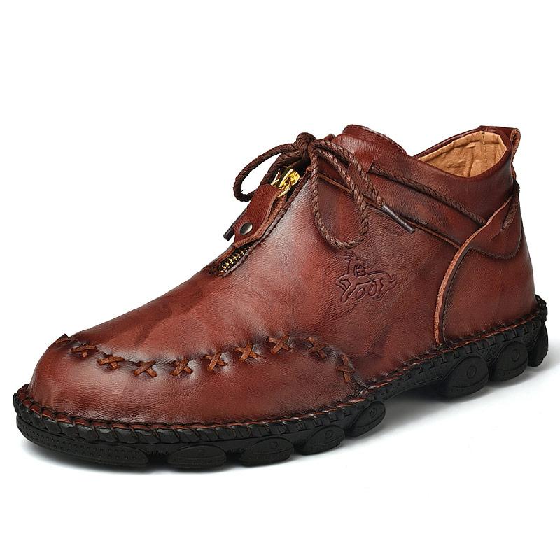 Stylish men's leather ankle boots, hand-stitched for durability and comfort in winter.