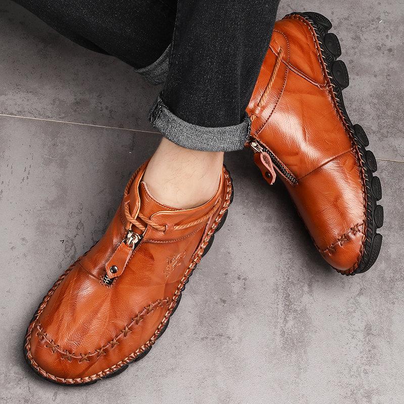 Pair of men's casual hand-stitched leather ankle boots, ideal for comfortable fall winter footwear.