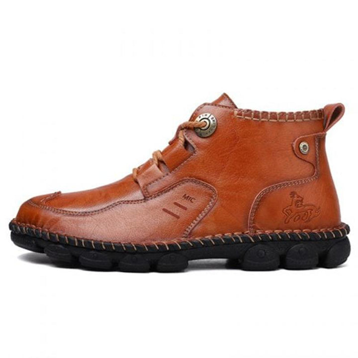 Men's casual brown leather boots on a natural background, ready for comfortable all-season use