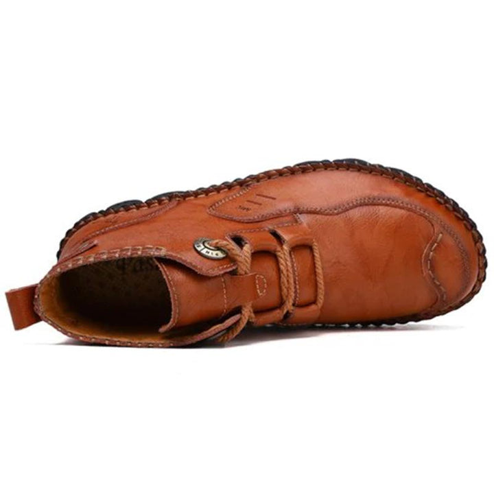 Boot sole detail of men's hand-stitched leather boots, designed for durability and good traction