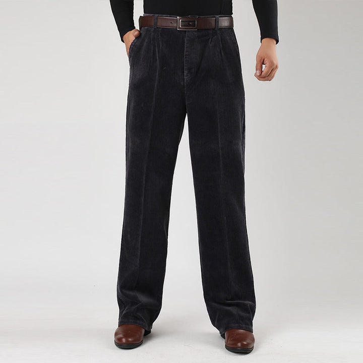 Stylish man wearing classic high-waist pleated pants, perfect for casual fashion