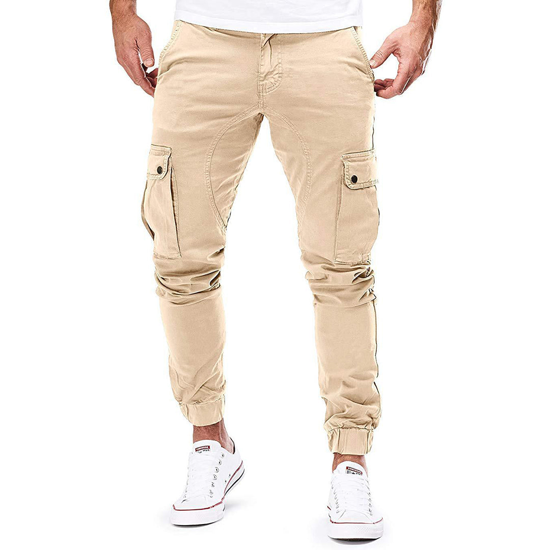 Full shot of a man wearing grey casual cargo trousers, suitable for outdoor activities