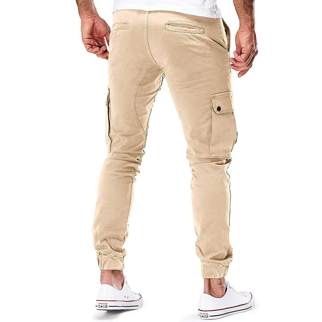 Men's black cargo pants with elasticated waist and ankle cuffs for a modern casual look