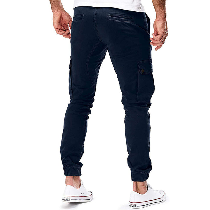 Detail of button and zipper on men's cargo trousers, durable and functional design