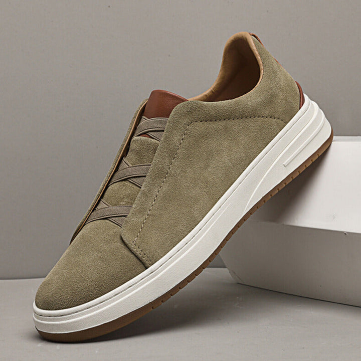 Men's casual khaki suede slip-on sneakers with white sole, perfect for everyday comfort and style.