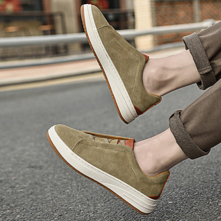 Side view of a men's blue suede slip-on sneaker, highlighting its low-profile and easy-wear style.