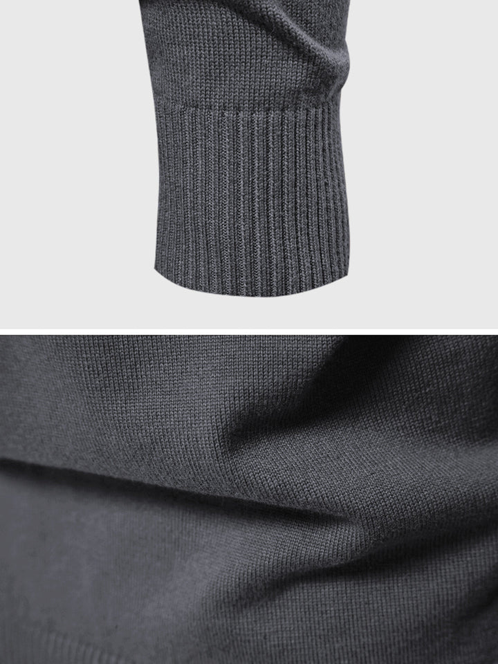 Detail shot of the long sleeve and cuff of a men's casual knit cardigan, highlighting the stitching.