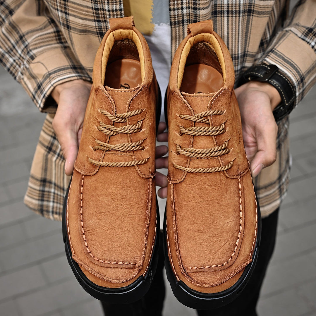 Durable leather high-top boots for men, casual style with soft sole for winter comfort.