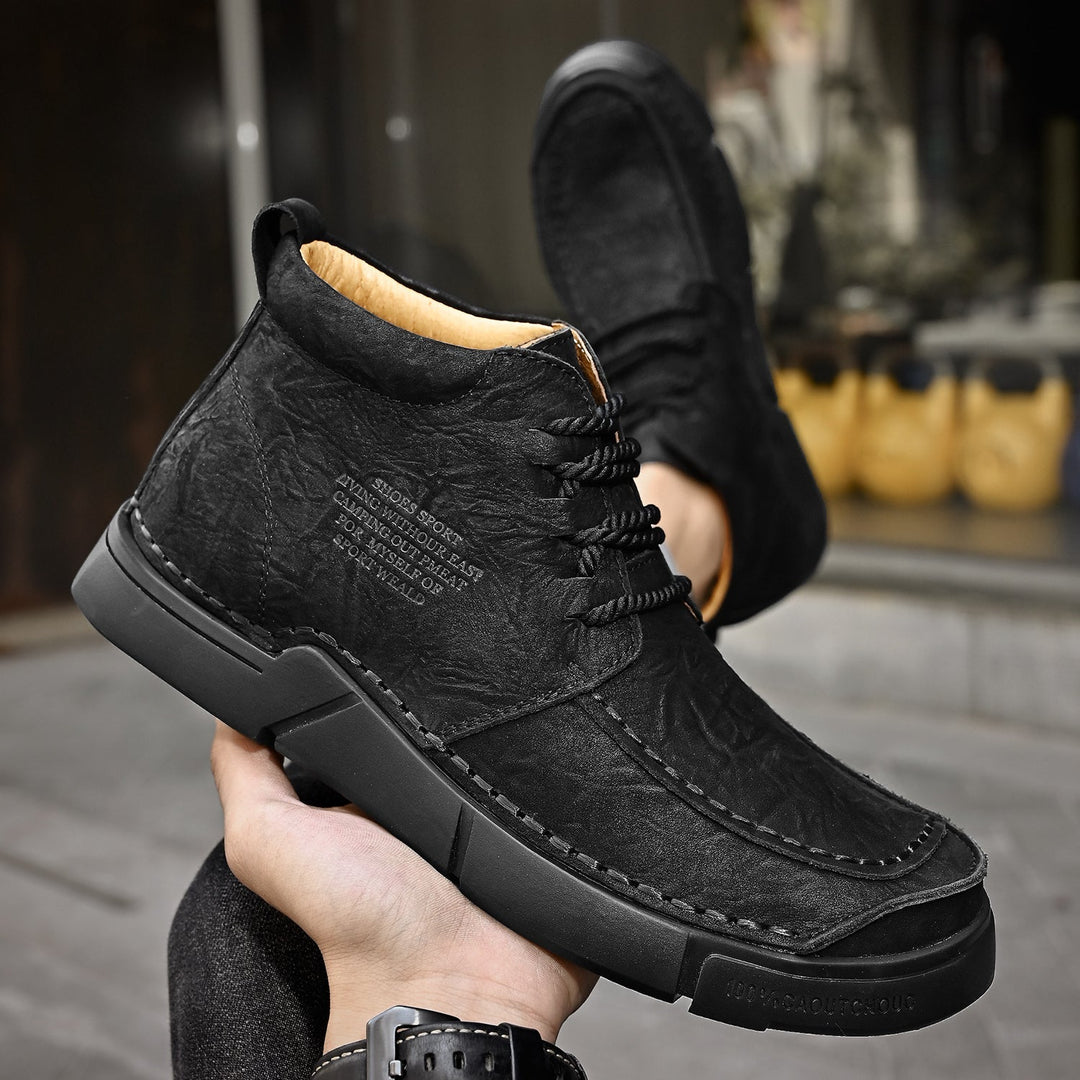 Men's leather high-top winter boots, durable and supportive with a soft sole for cold weather.
