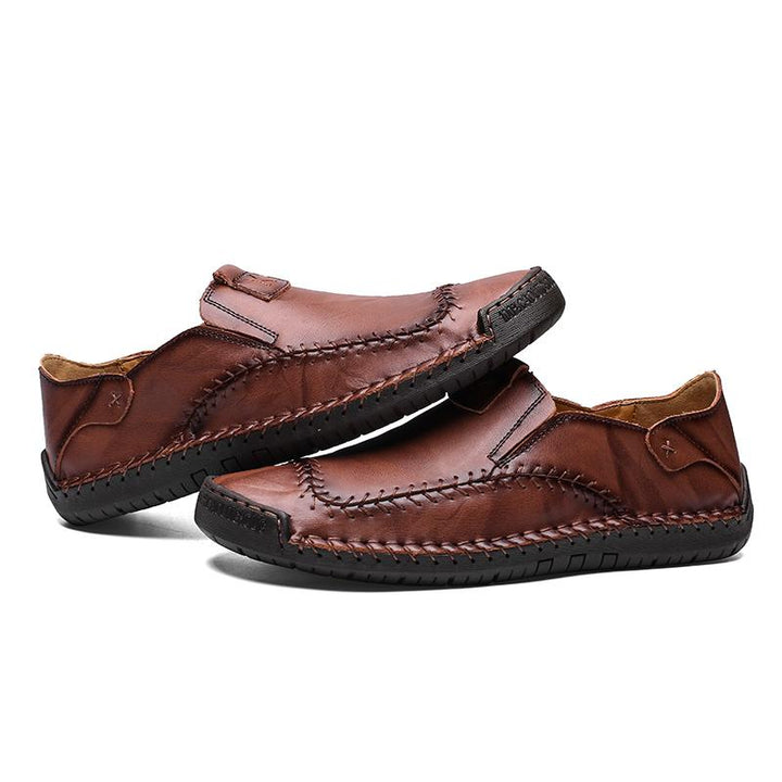 Pair of men's hand-stitched genuine leather casual shoes, highlighting the comfortable soft sole