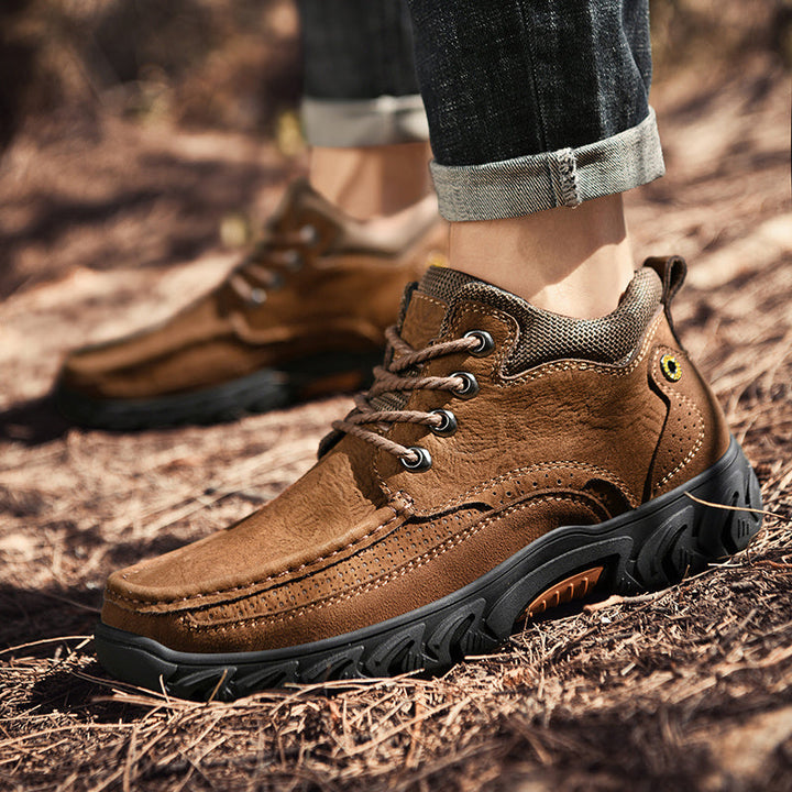 Close-up of the waterproof leather on men's short outdoor boots
