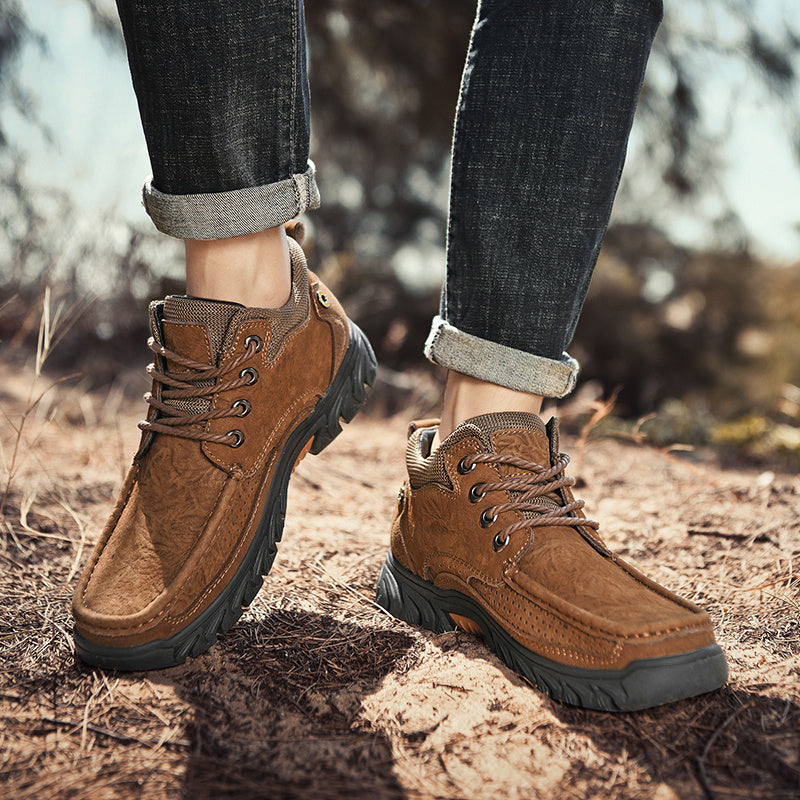 Action shot of men's leather outdoor boots being worn in a snowy setting