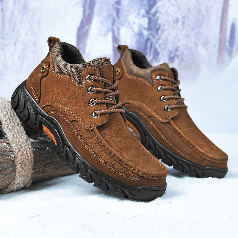 Close-up of the lacing system on men's leather snow boots, secure fit