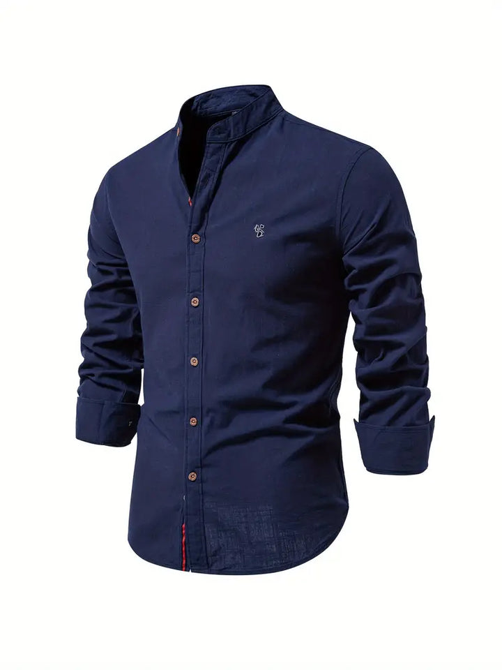 Detail of the collar and top buttons of a men's casual long sleeve shirt, spring fashion.