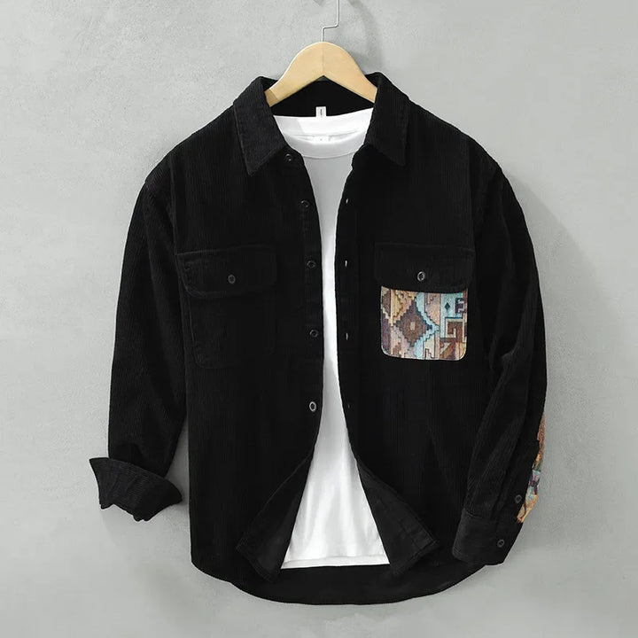 Front view of a men's long-sleeve cotton shirt, showcasing its casual design and distinctive patterned pocket.