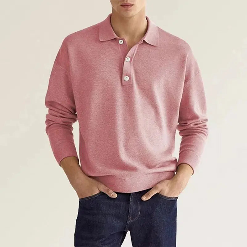 Men's casual long sleeve knit polo shirt in blue folded neatly, emphasizing its soft fabric