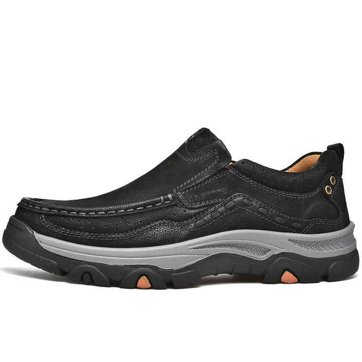 Stylish black leather slip-on shoes for men, featuring orthopedic support for improved walking posture.