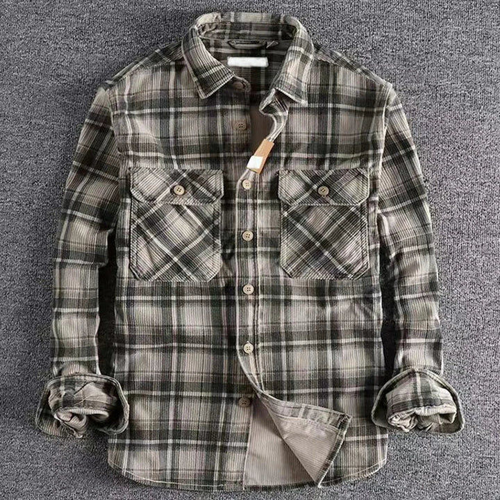 Close-up of a men's plaid flannel shirt, showcasing the soft fabric and classic button-up design.