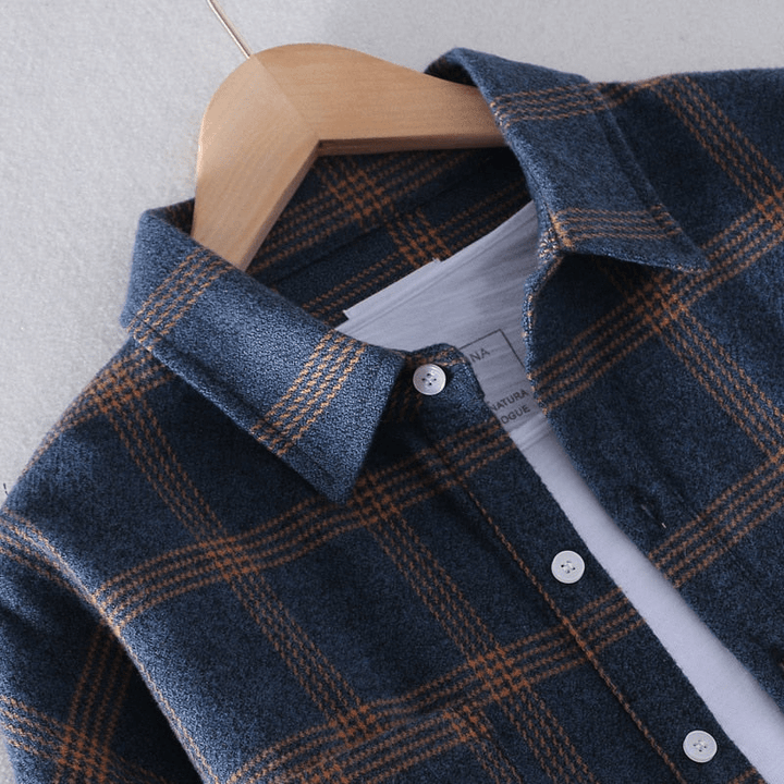 Stylish men's checkered button-down shirt with long sleeves, perfect for casual wear. Durable men's fashion.