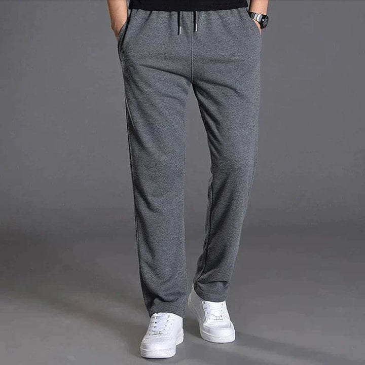 Men's everyday relaxed fit pants in a classic navy, suitable for spring casual menswear outfits.