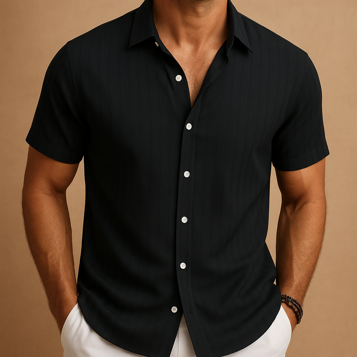 Warm weather men's shirt, short sleeve, button-up, offering a relaxed yet refined casual style.