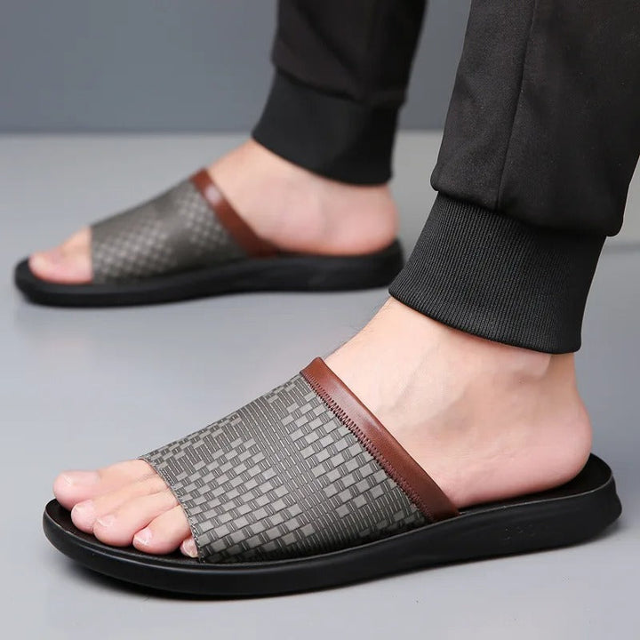 Side view of men's slip-on sandals, highlighting the easy-to-wear casual style