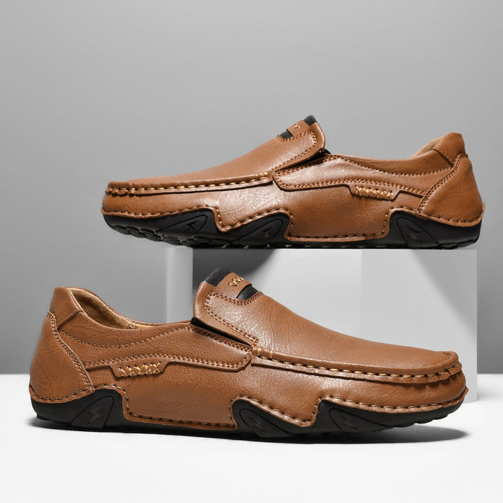 Detailed view of the stitching on men's casual faux leather loafers, emphasizing craftsmanship