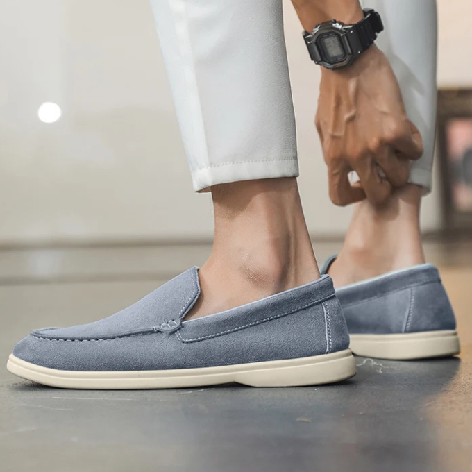 Detail of the stitching on men's suede-look loafers, showing craftsmanship of casual footwear.