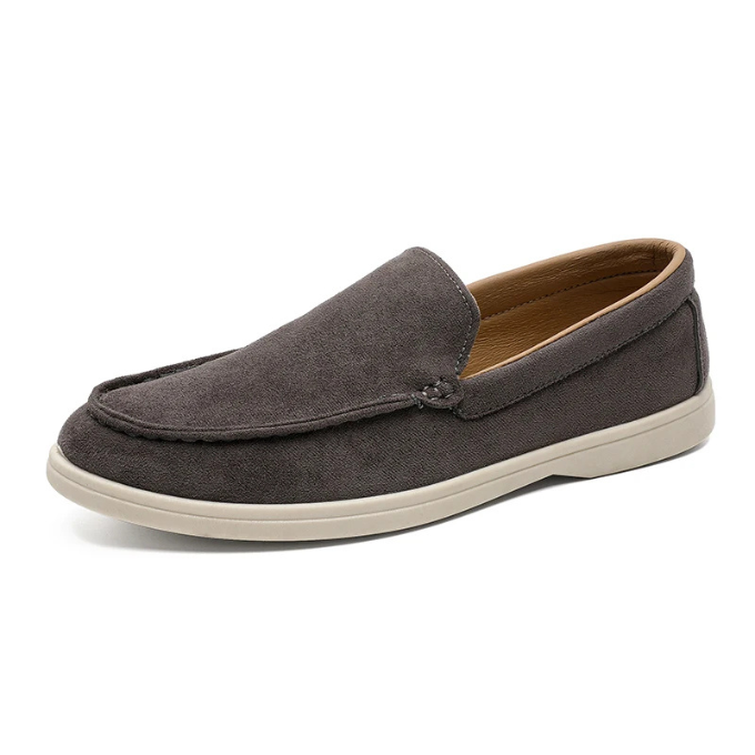 Men's casual suede-look loafers displayed angled, highlighting their soft texture.