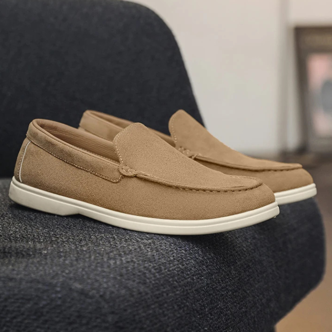 Close-up of the textured suede-look material on men's casual slip-on loafers, highlighting quality.