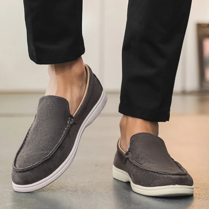 Men's suede-look loafers in a neutral color, versatile casual footwear for any outfit.