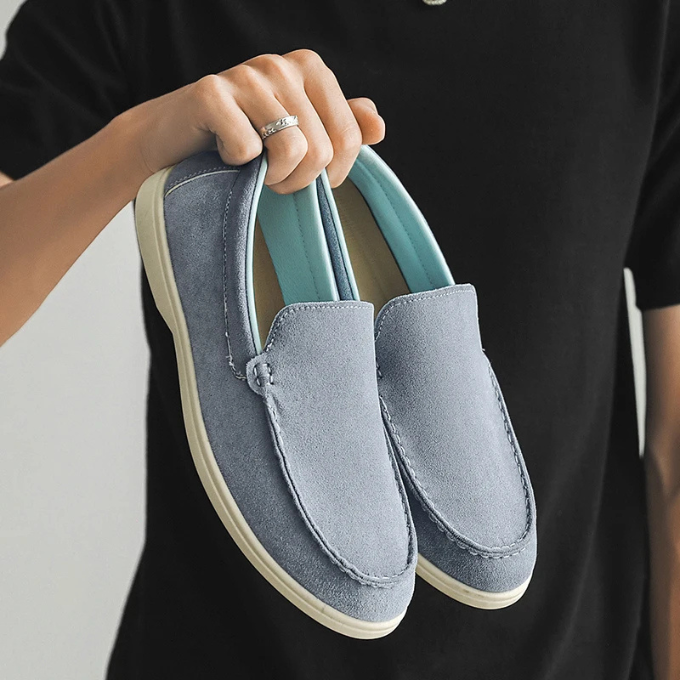 Top-down view of men's comfortable casual suede-look loafers, ready to be slipped on.
