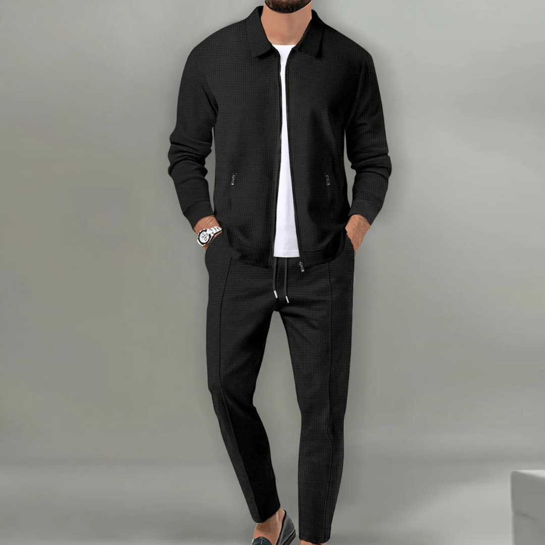 A men's two-piece tracksuit, a versatile loungewear and athletic wear combo with a zip-front jacket.