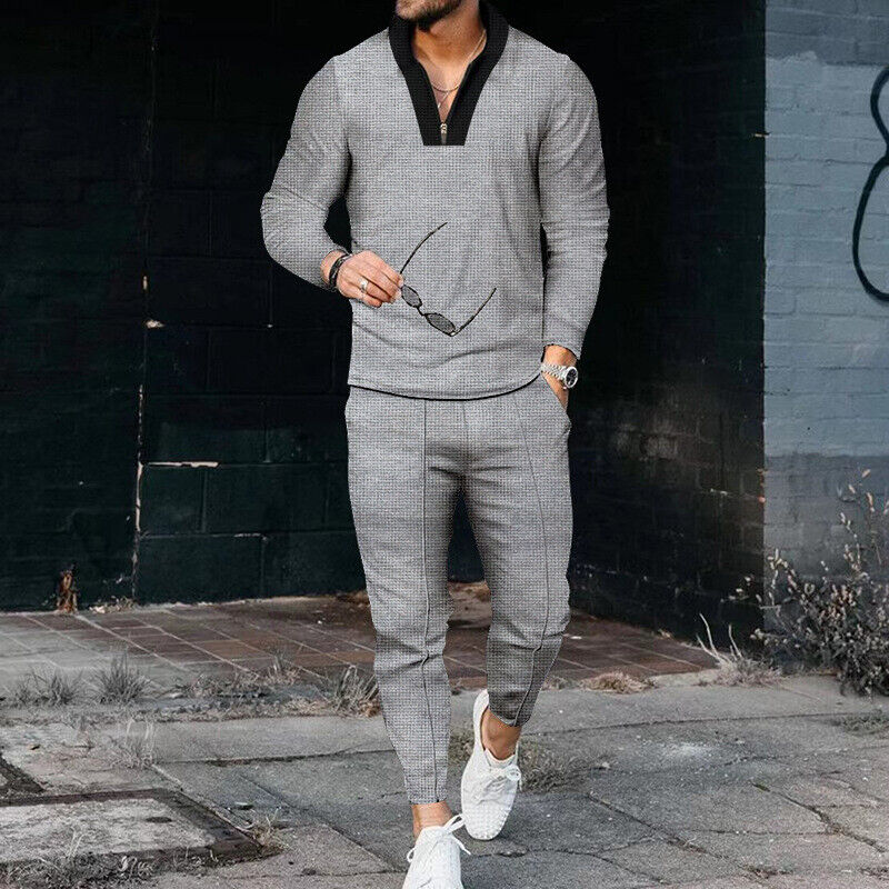 Close-up of the fabric texture on a men's casual two-piece tracksuit, highlighting comfort.