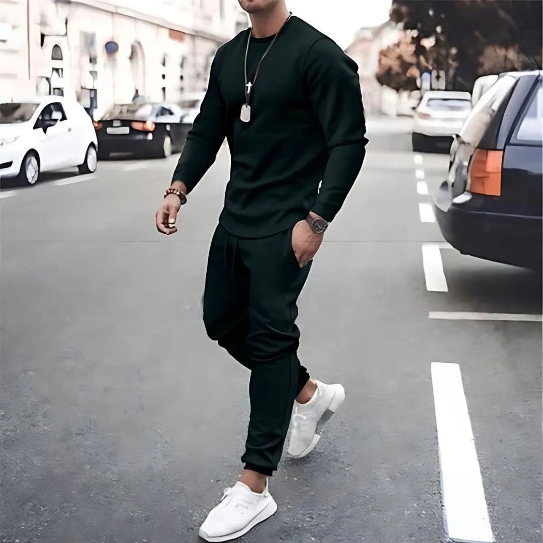 Model wearing a men's two-piece tracksuit set, showcasing the casualwear style and versatile athleticwear aesthetic.