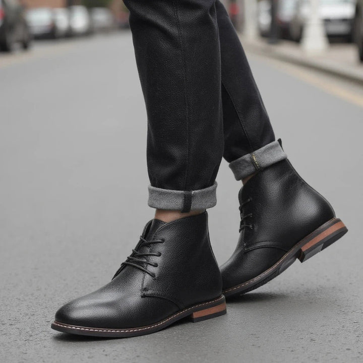 Pair of men's black chukka boots, ready for comfortable and stylish wear.