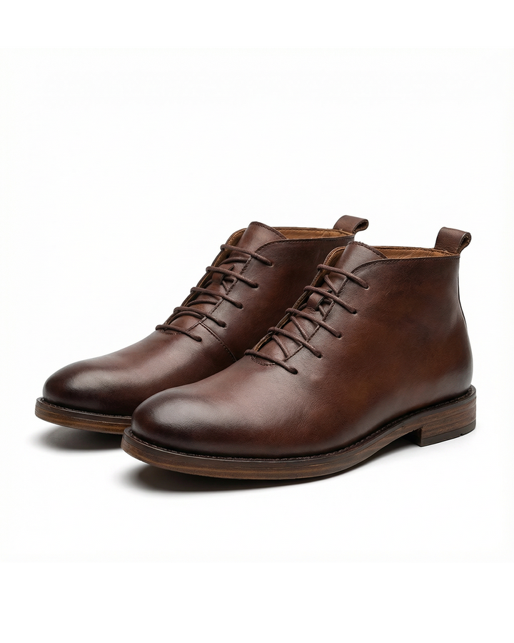 Men's classic black leather Chelsea boots, side view, sleek and formal.